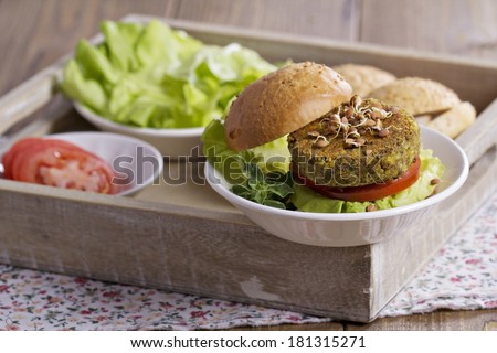Vegan burgers with chickpeas served with fresh vegetables