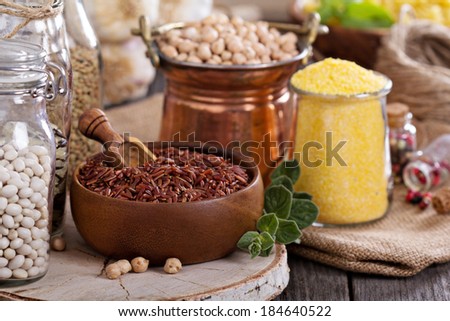 Variety of grains and beans on a wooden table
