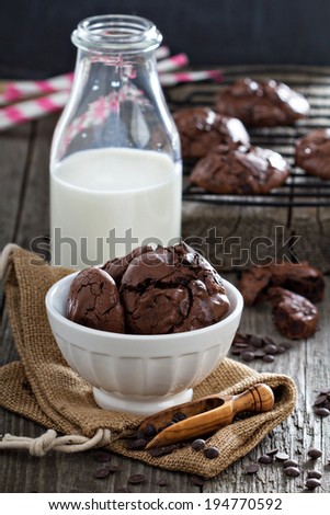 Chocolate meringue cookies in a bowl with chocolate drops