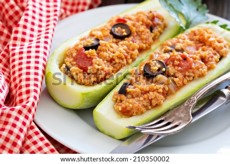 Vegan stuffed squash with millet, tomatoes and olives