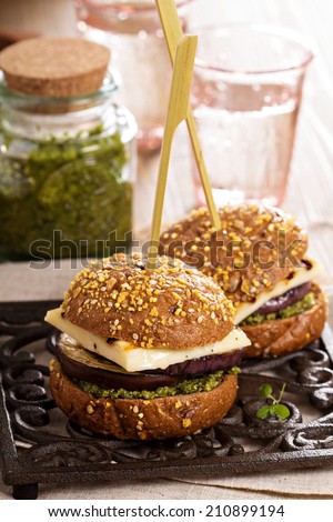 Vegetarian burger with grilled cheese, eggplant and pesto
