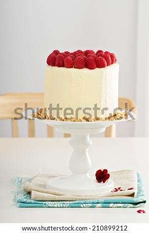 Birthday cake with cream cheese and raspberries