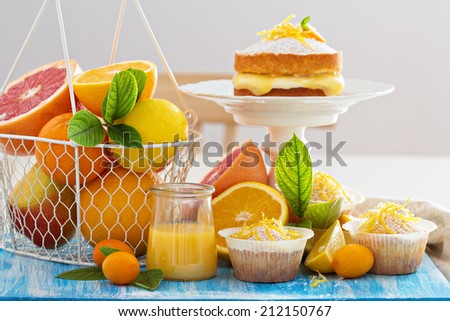 Citrus candy bar with fresh citrus fruits and cakes