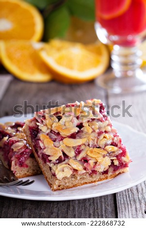 Berry cake bars with caramel almond topping on a plate