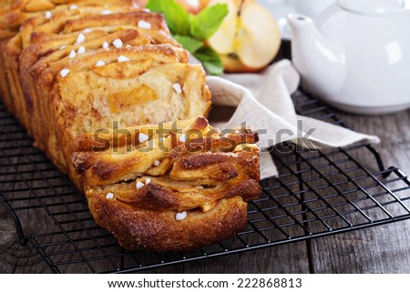 Apple cinnamon pull-apart bread on cooling rack