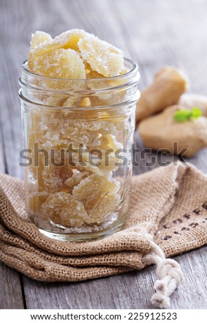 Homemade sugared candied ginger in a glass jar
