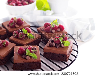 Chocolate  mousse brownies with fresh raspberries and chocolate pieces