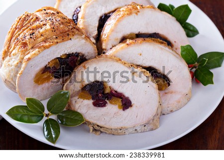 Roasted pork loin stuffed with dried fruits for Christmas table