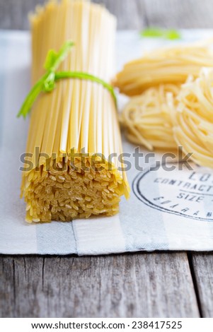 Raw pasta on a napkin Linguine and pasta nests