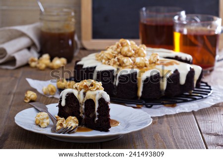 Chocolate cake with cream cheese glaze and caramel sauce