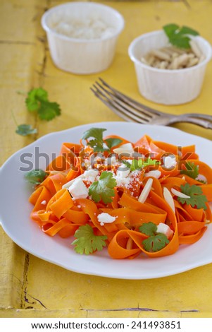 Carrot pasta salad with feta and almonds