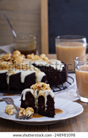 Chocolate cake with cream cheese glaze and caramel souce
