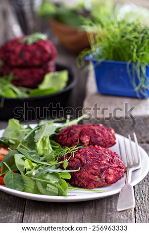Beet root and red bean vegan burgers with salad