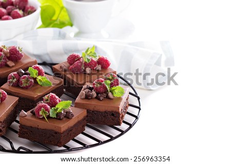 Chocolate mousse brownies with raspberry isolated on white