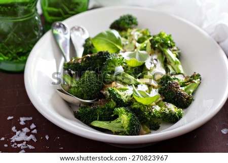 Pan roasted broccoli with crispy garlic on plate