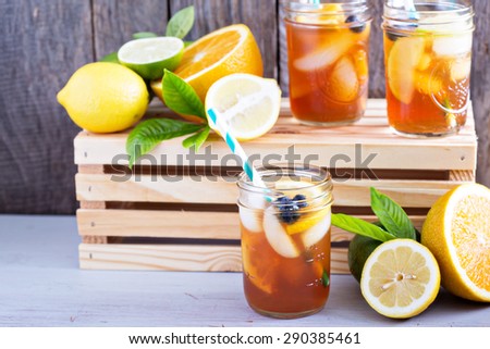 Homemade iced tea in mason jars with straws