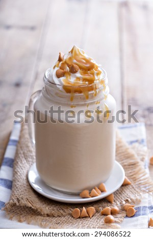 Caramel frappuccino with syrup in mason jar