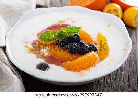 Yogurt with citrus fruit compote and blueberries