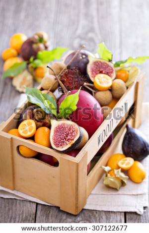 Variety of exotic fruits in a wooden crate
