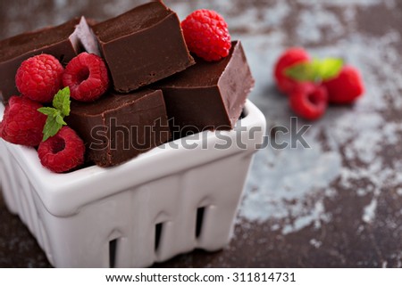 Chocolate fudge pieces with raspberries homemade and delicious