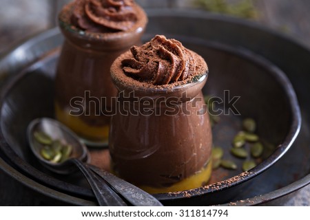 Healthy vegan chocolate pumpkin pudding in jars