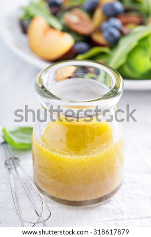 Salad dressing with olive oil, honey, mustard and vinegar