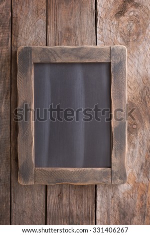 Wooden rustic background with a rustic chalkboard