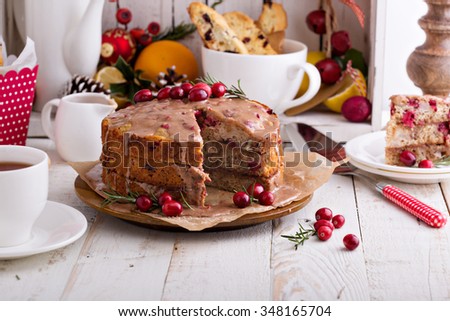 Orange and cranberry christmas cake with cinnamon glaze