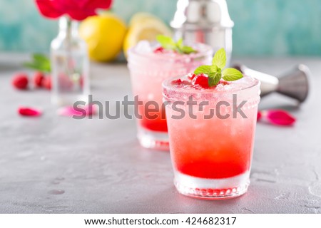 Raspberry crushed ice cold refreshing cocktail with mint
