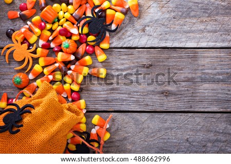 Halloween candy copy space with candycorn and spiders