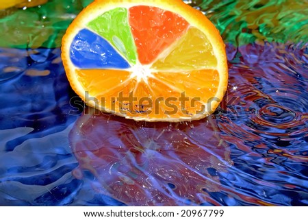 Splash with fresh citrus. Pure water. Blue background.