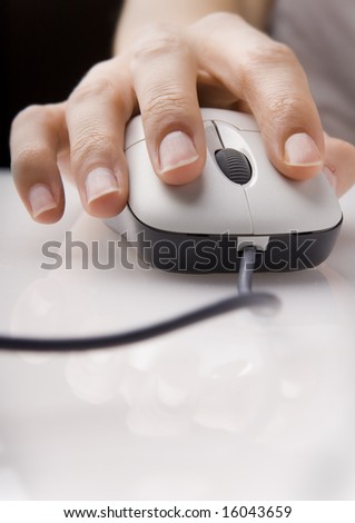 Close up of a female hand using mouse