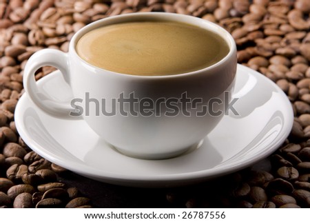 Double espresso on coffee beans