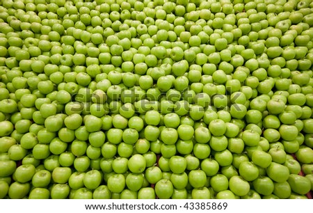 Pile of green apples forming a background