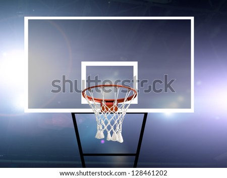 Glass basketball board and hoop in an arena