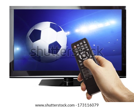 Male hand holding remote control with a football game on screen isolated on white