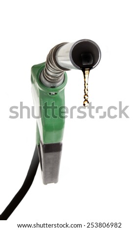 Green gas pump with strong perspective with one last drop of fuel isolated on white