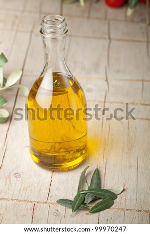 Olive oil bottle on wooden table