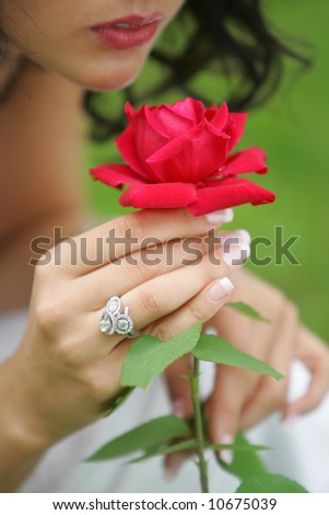 Sexy bride holding rose