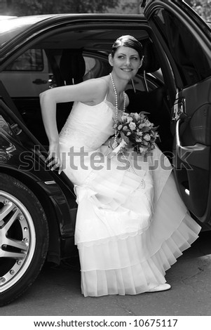 Bride getting out of wedding limo