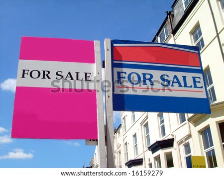 Two for sale sign in English street, with space for company names.