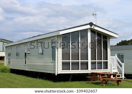 Exterior of modern caravan, trailer or mobile home in park - generic one available for hire.