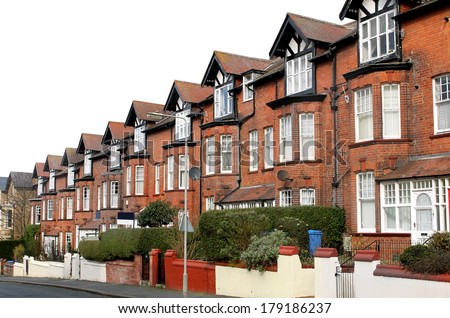 Row of old terraced houses on a street, Scarborough, England.