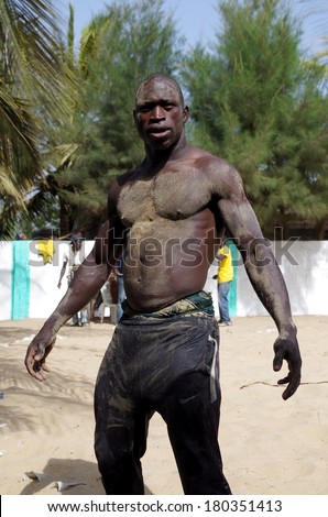 PARADISE BEACH, GAMBIA, FEBRUARY 23, 2014 - Portrait of professional Gambian wrestler. Wrestling is one of the most popular sports in Western Africa.