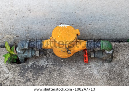 Old Water Valve with Yellow Water Meter
