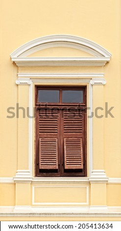 Vintage Wooden Window with shutters in colonial architecture style building