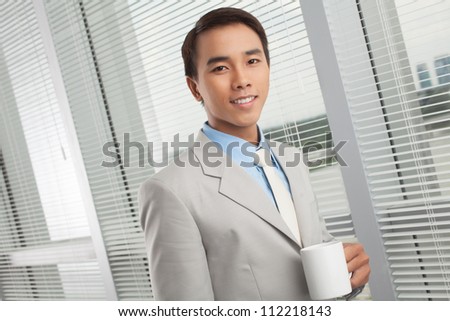Portrait of a successful young man in the middle of the coffee break