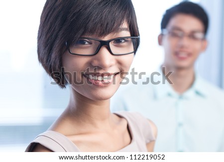 Close-up portrait of a cute young leader looking at the viewer with a smile