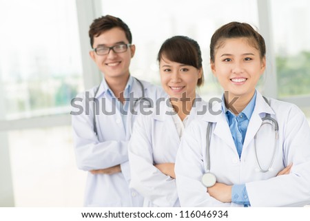 Portrait of a group of young medial workers with positive attitude towards their work