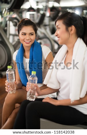 Vertical image of two lovely girls keeping fit
